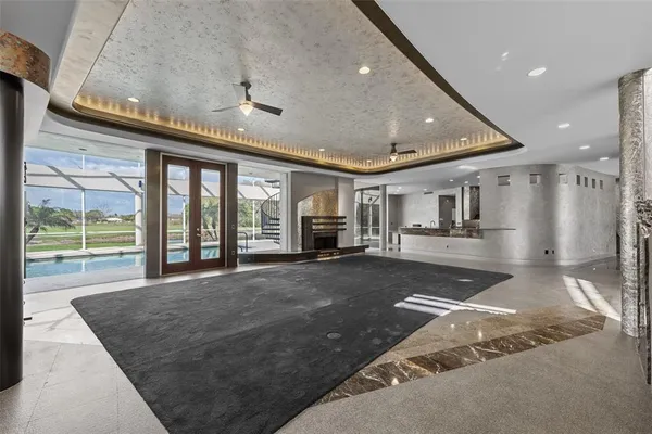 a view of a livingroom with furniture and a ceiling fan