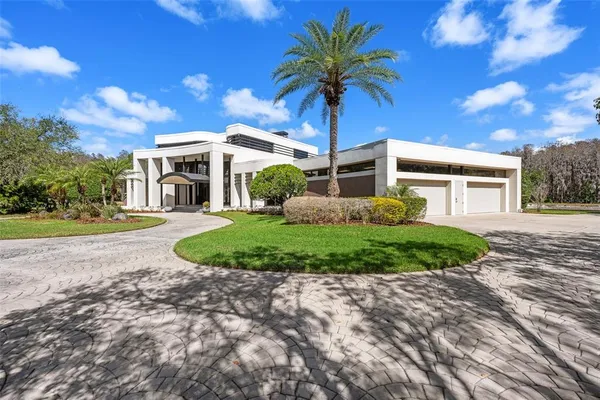 a view of a house with a tree