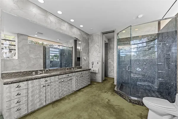 a kitchen with stainless steel appliances granite countertop a stove and a refrigerator