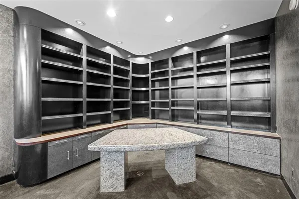 a view of an empty room with a swimming pool