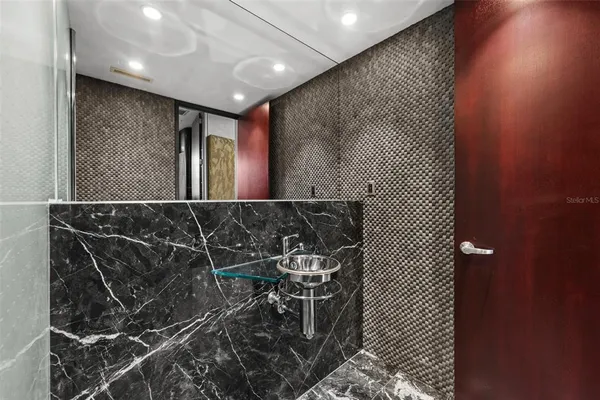 a view of a swimming pool with seating area