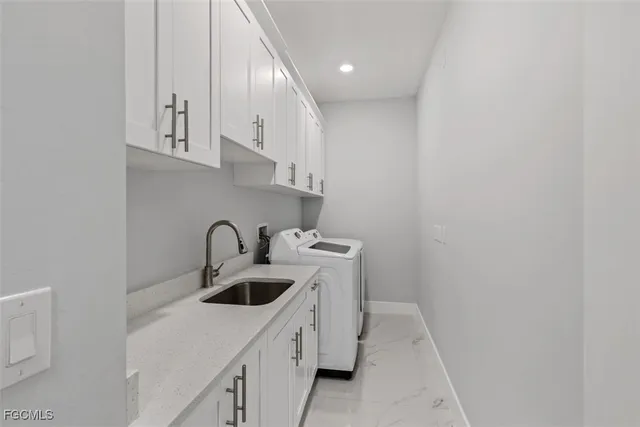a kitchen with a sink a stove and cabinets