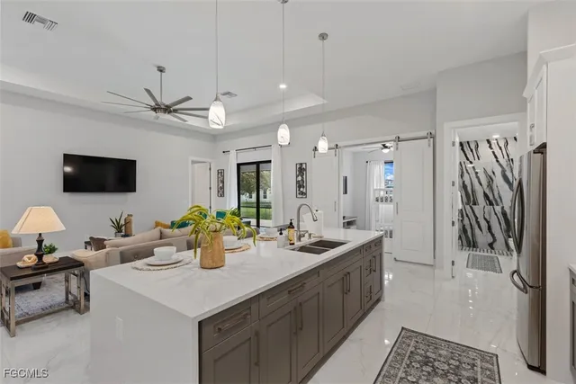 a kitchen with a sink appliances and cabinets
