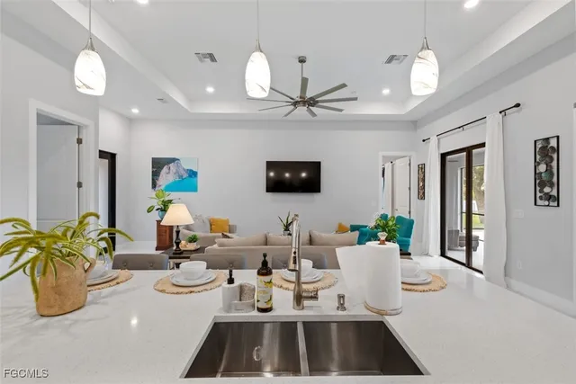 a view of a dining room with furniture and a chandelier