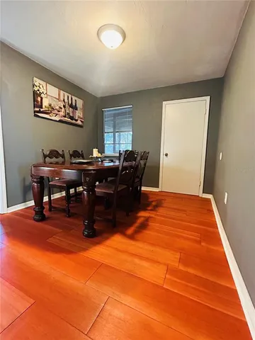 a workspace room with furniture and window