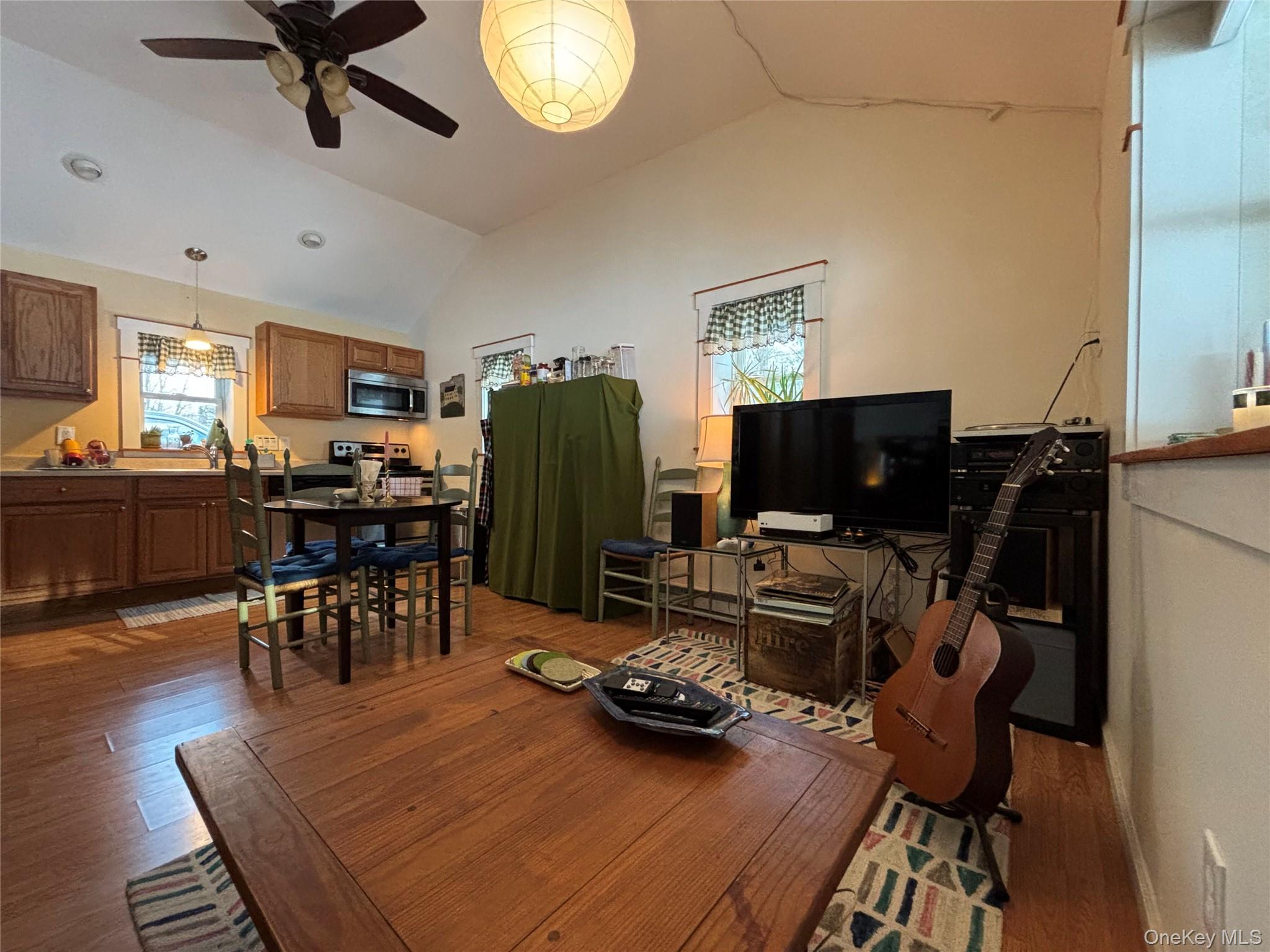 273 South Road Holmes, NY 12531 - Photo 11 of 13 Dining space with vaulted ceiling, ceiling fan, and dark wood-style flooring