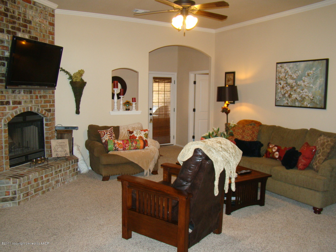 3715 Arden Road Amarillo, TX 79118 - Photo 2 of 24 a living room with furniture fireplace and flat screen tv