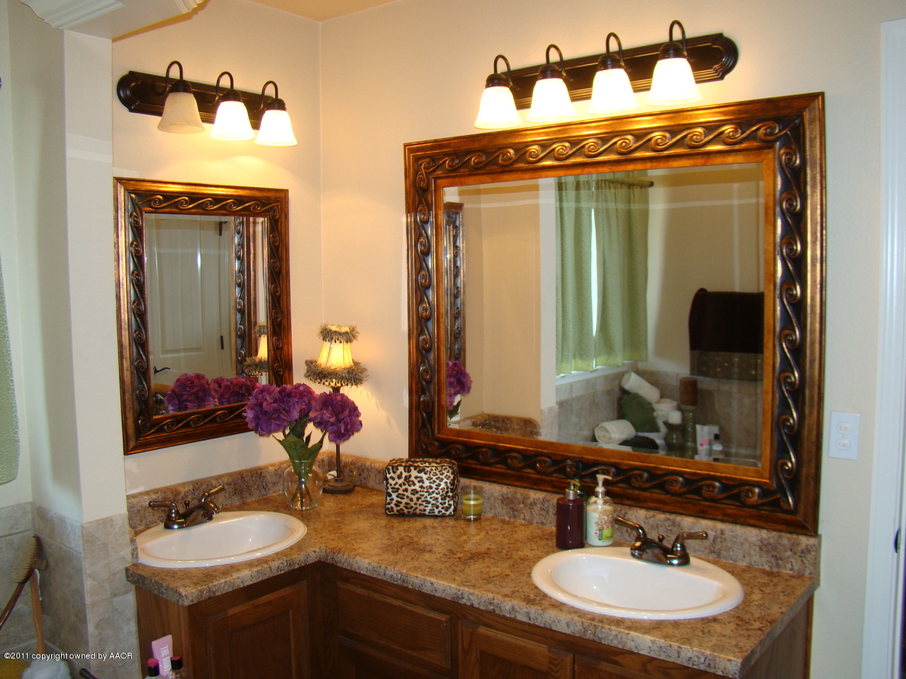 3715 Arden Road Amarillo, TX 79118 - Photo 17 of 24 a bathroom with a sink and a mirror