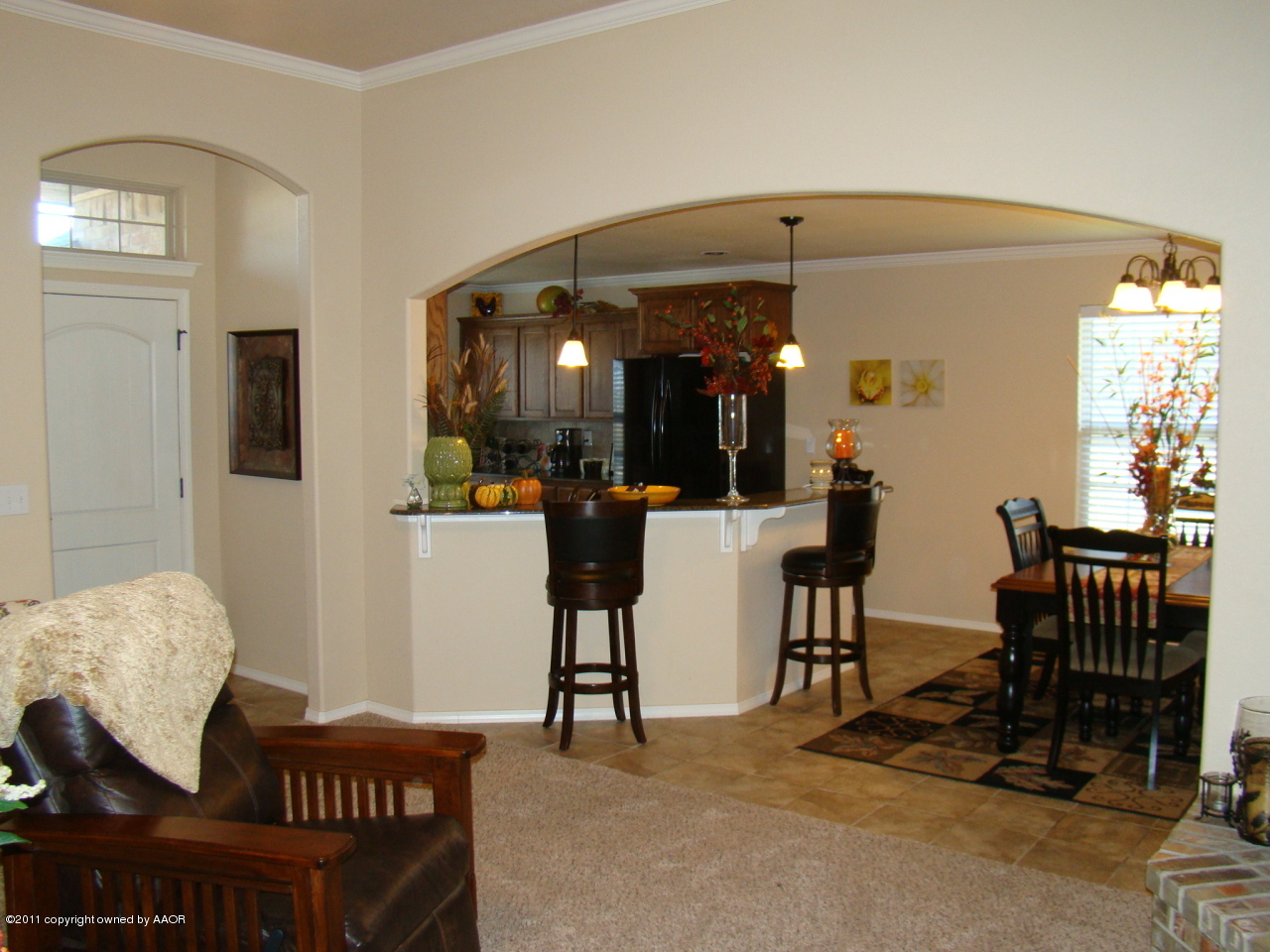 3715 Arden Road Amarillo, TX 79118 - Photo 4 of 24 a view of a dining room with furniture and chandelier