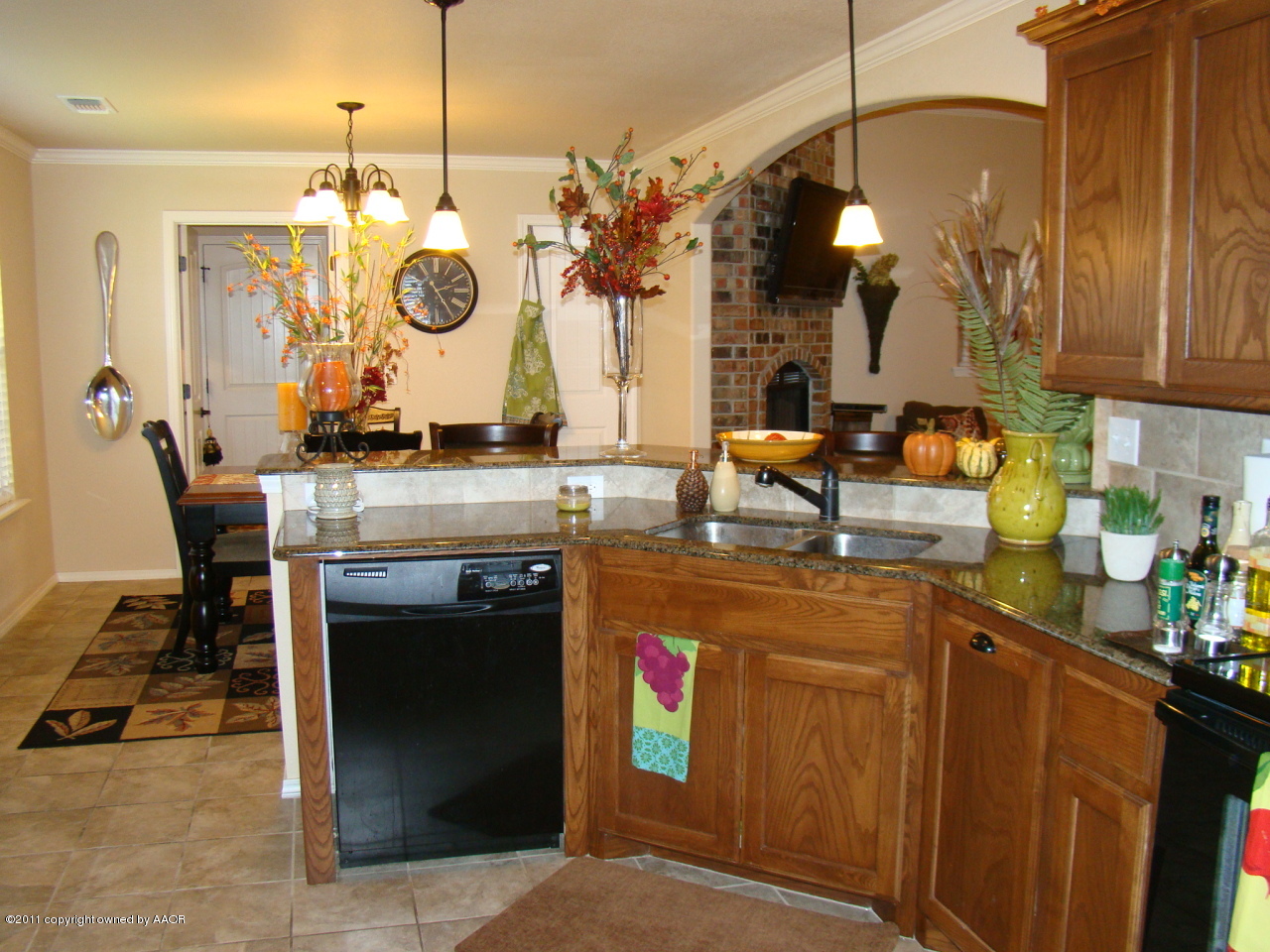 3715 Arden Road Amarillo, TX 79118 - Photo 9 of 24 a kitchen with a stove a sink and a refrigerator