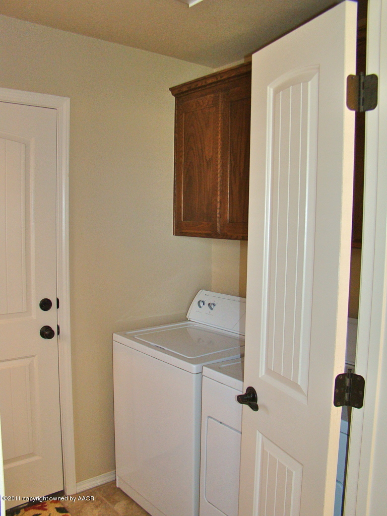 3715 Arden Road Amarillo, TX 79118 - Photo 10 of 24 a utility room with dryer and washer