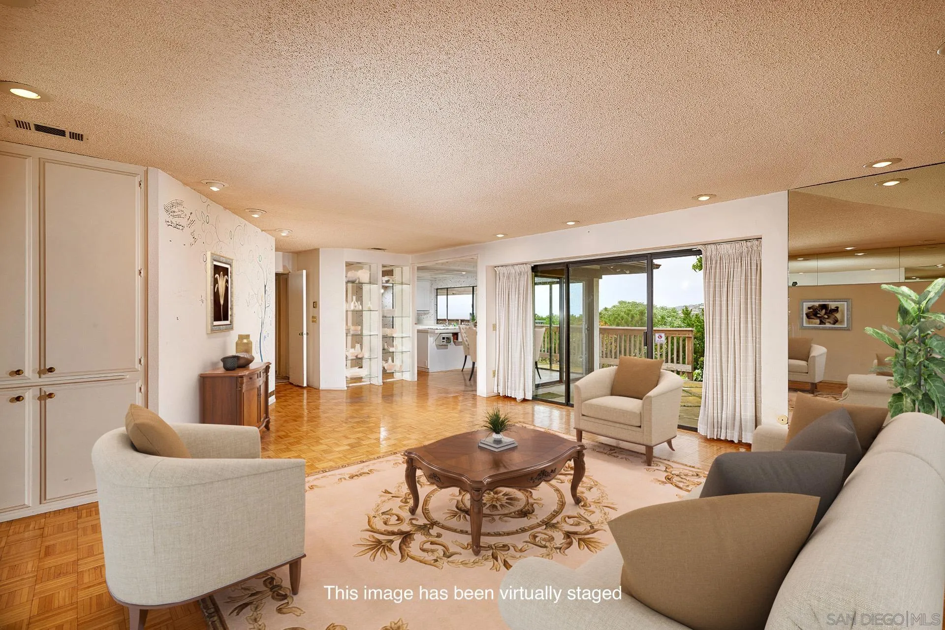 7774 Via Capri La Jolla, CA 92037 - Photo 23 of 45 a living room with furniture and a large window