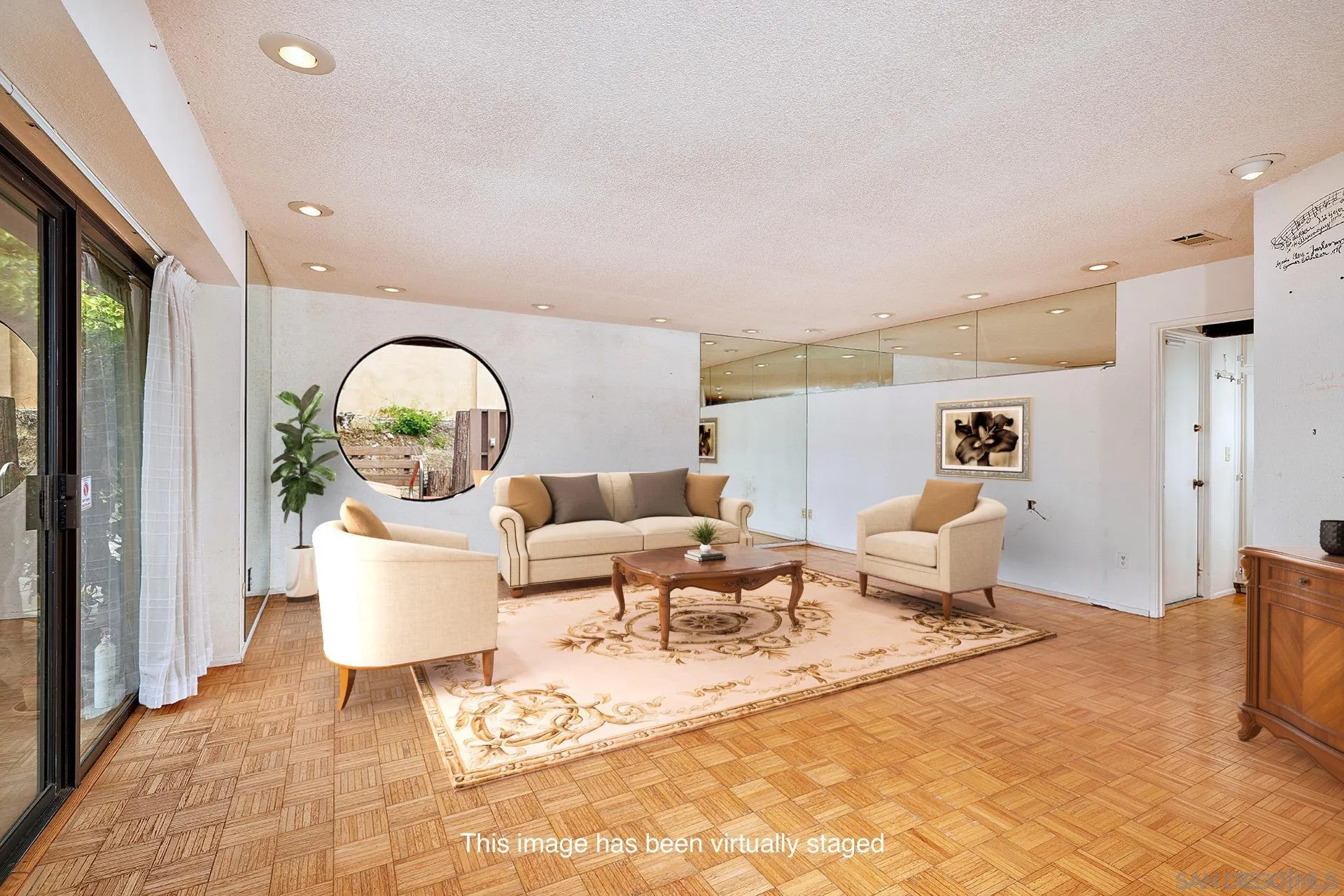 7774 Via Capri La Jolla, CA 92037 - Photo 24 of 45 a living room with furniture a rug and a window