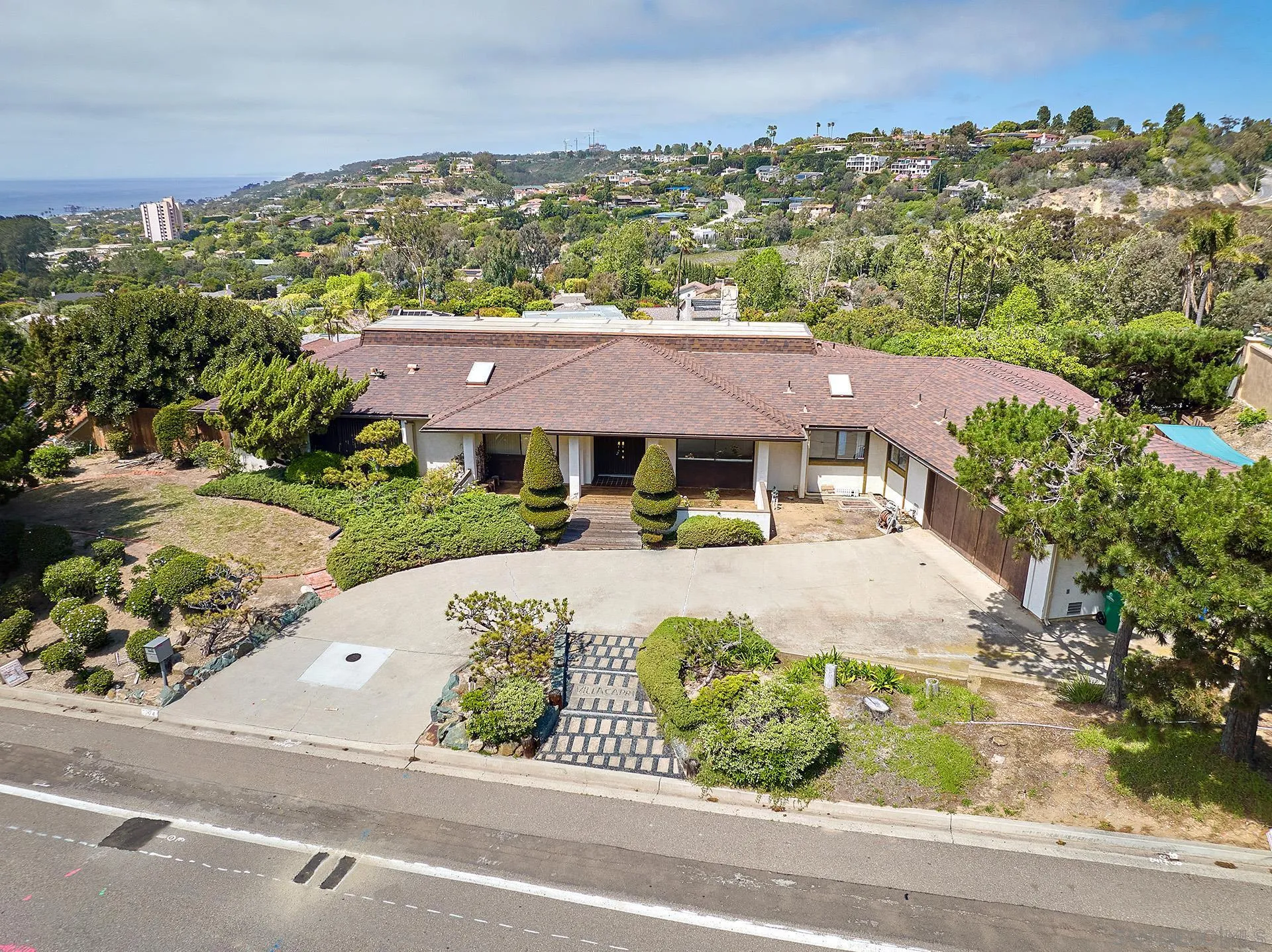 7774 Via Capri La Jolla, CA 92037 - Photo 25 of 45 an aerial view of a house with a garden and balcony