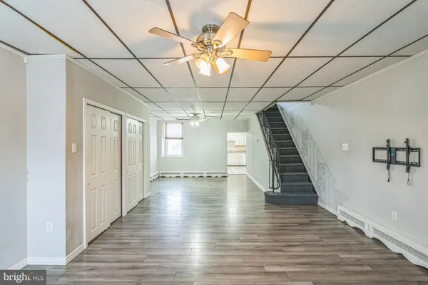 a view of entryway with stairs and wooden floor