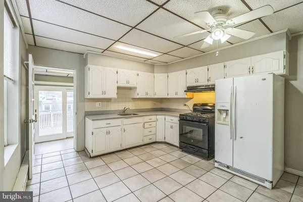 a kitchen with a refrigerator a sink and dishwasher