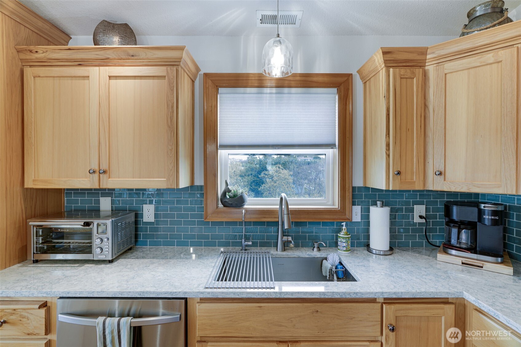 33410 G Street Ocean Park, WA 98640 - Photo 21 of 40 a kitchen with stainless steel appliances granite countertop a sink a counter space and cabinets
