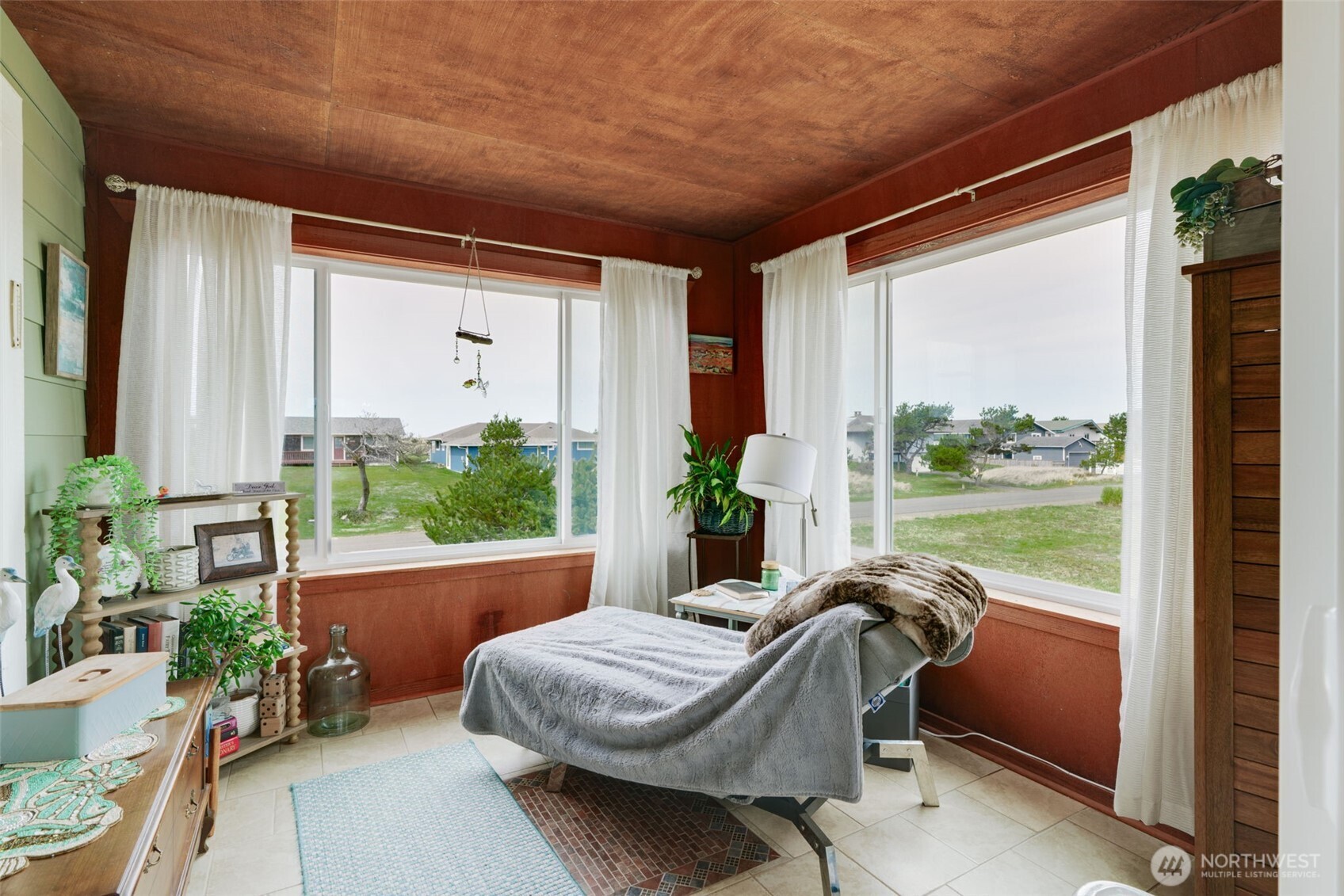 33410 G Street Ocean Park, WA 98640 - Photo 27 of 40 a balcony with furniture and a potted plant