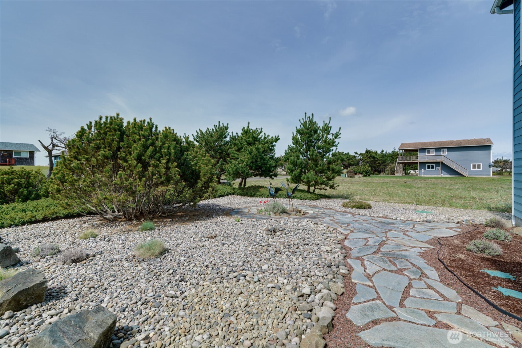 33410 G Street Ocean Park, WA 98640 - Photo 33 of 40 a view of a dirt road with a building in the background