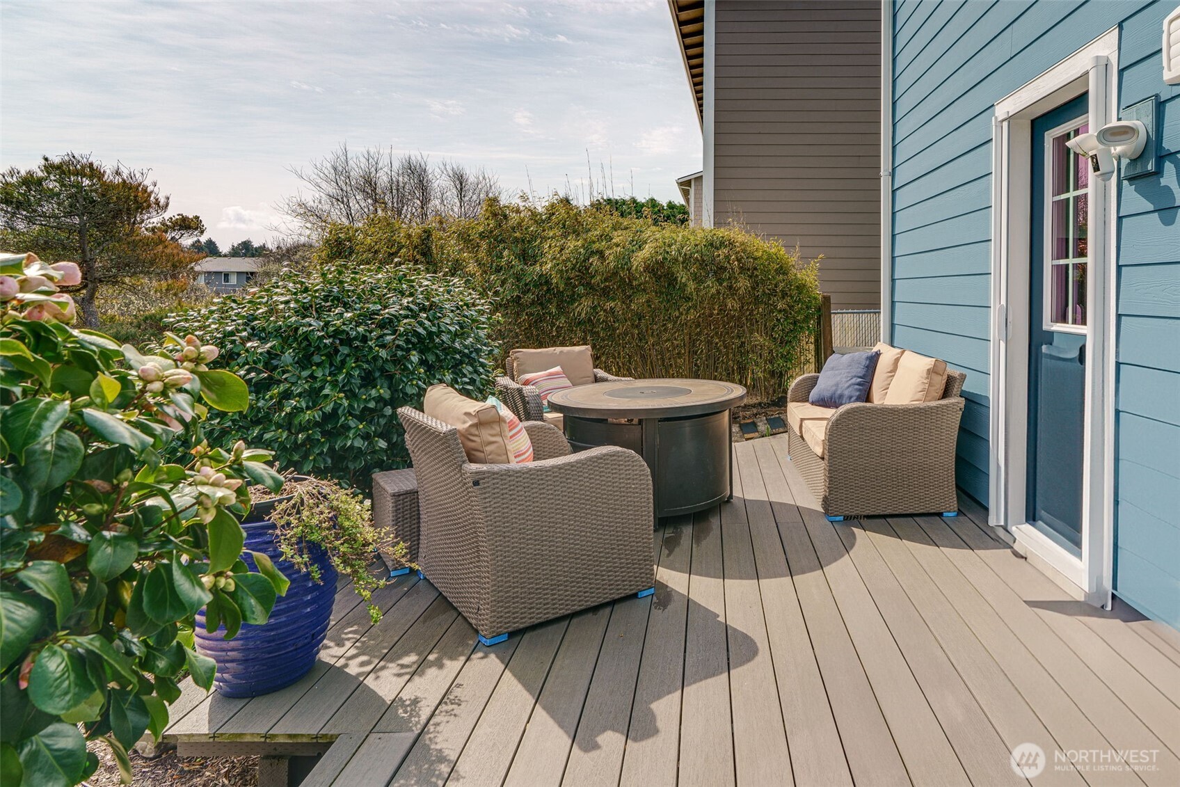 33410 G Street Ocean Park, WA 98640 - Photo 34 of 40 a view of a deck with couches table and chairs and potted plants