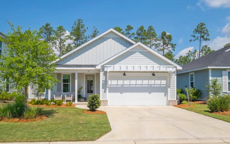 21 Windrow Way Rosemary Beach, FL 32461 - Photo 1 of 38 a view of a house with a yard and potted plants
