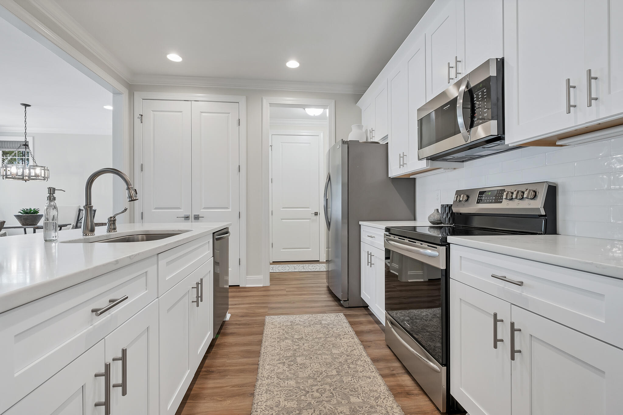 21 Windrow Way Rosemary Beach, FL 32461 - Photo 11 of 38 a kitchen with stainless steel appliances kitchen island granite countertop a refrigerator and a sink