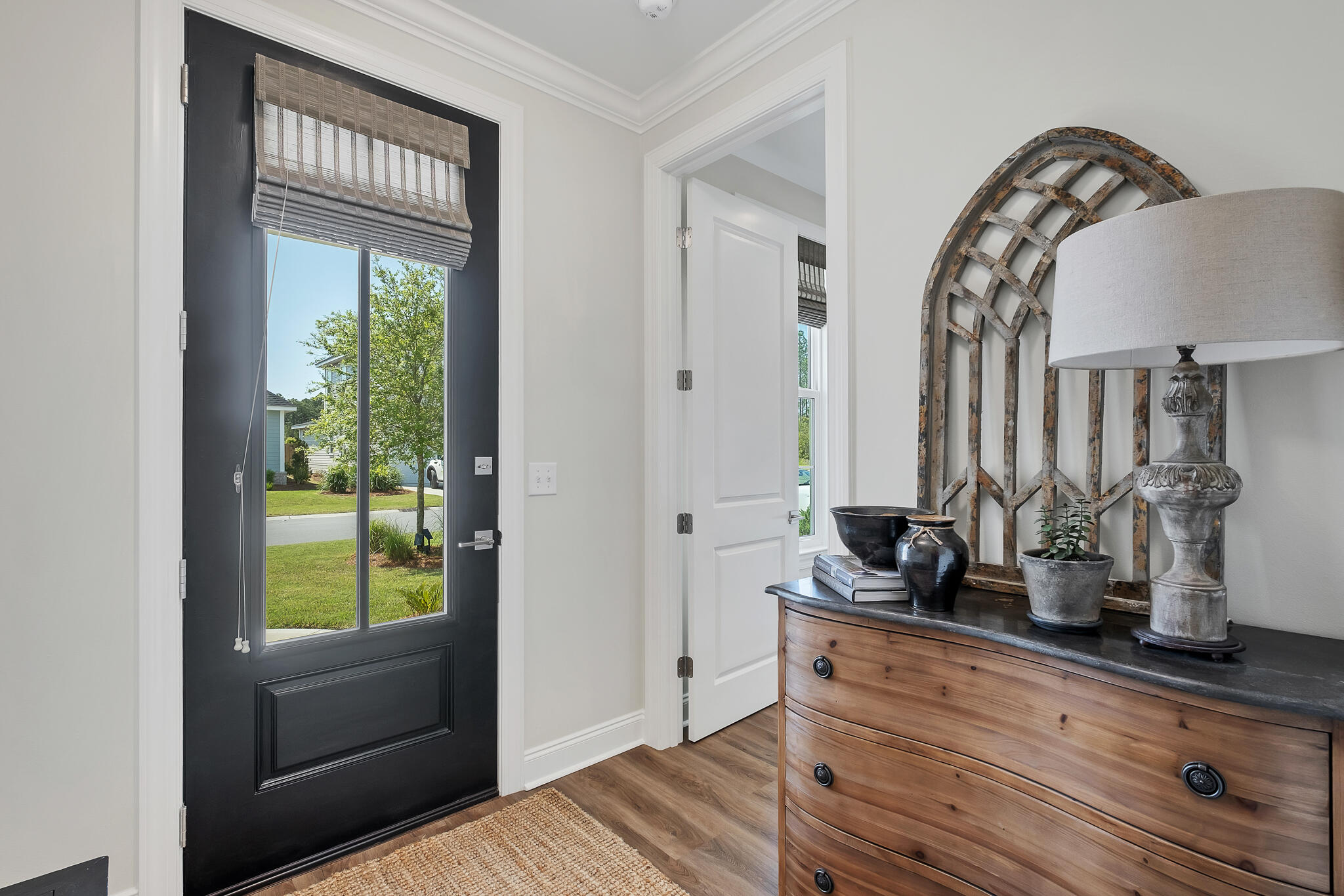 21 Windrow Way Rosemary Beach, FL 32461 - Photo 2 of 38 a room with a large mirror and a wooden floor