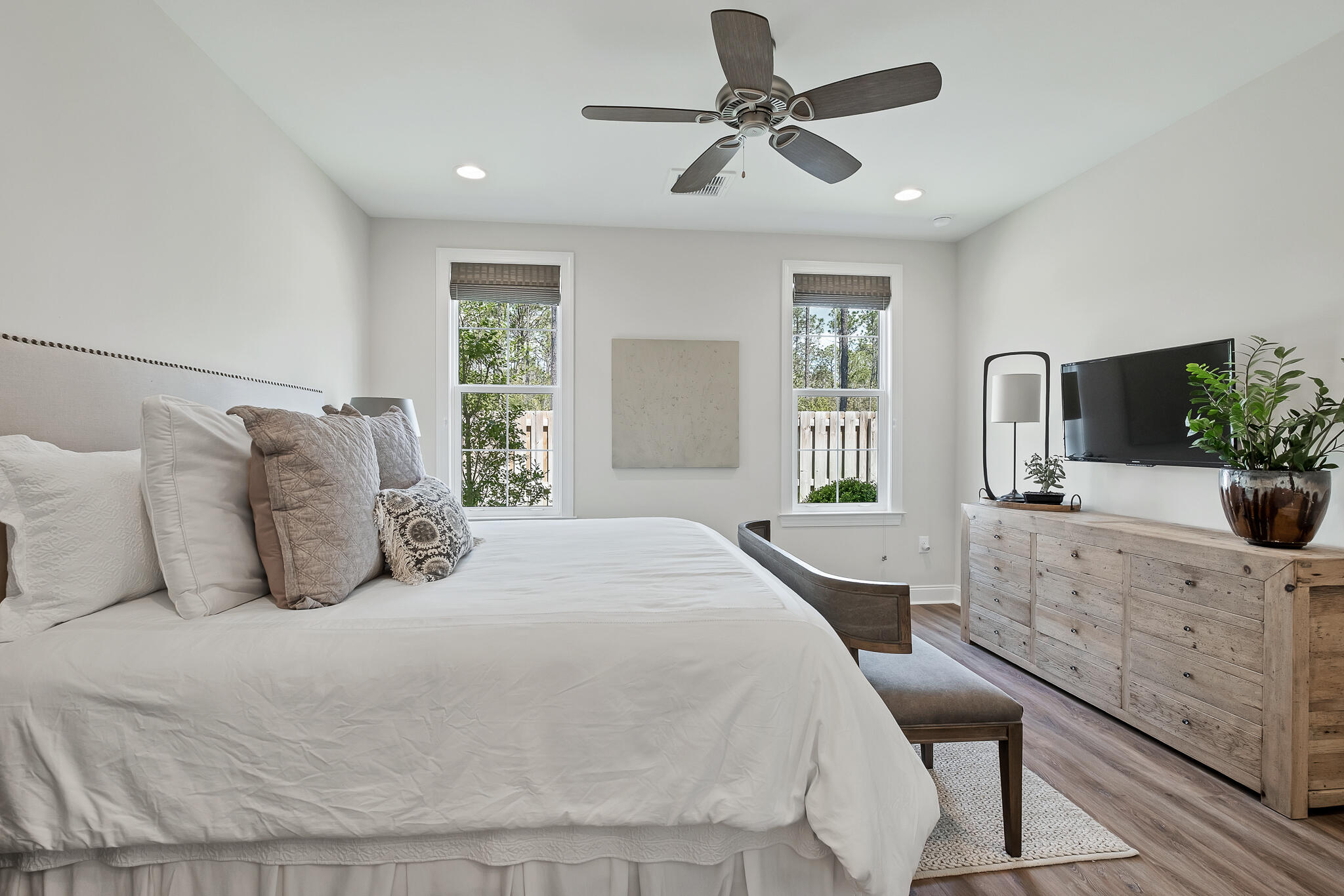 21 Windrow Way Rosemary Beach, FL 32461 - Photo 22 of 38 a bedroom with a large bed and a chandelier