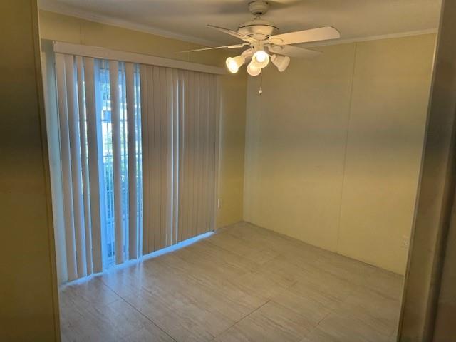 3 Gardenia Lane Davie, FL 33325 - Photo 11 of 17 an empty room with wooden floor and fan view