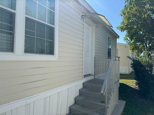 3 Gardenia Lane Davie, FL 33325 - Photo 3 of 17 a view of wooden house with a small yard
