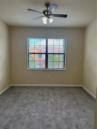 a view of a house with a yard and furniture