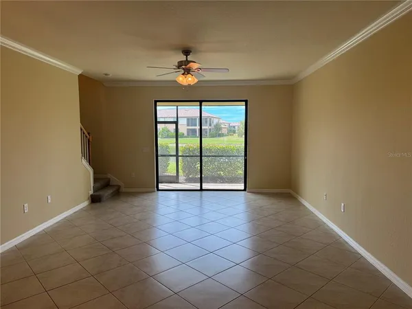 a kitchen with granite countertop wooden cabinets a stove a oven and a microwave