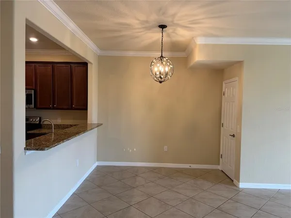 a kitchen with granite countertop a sink and cabinets
