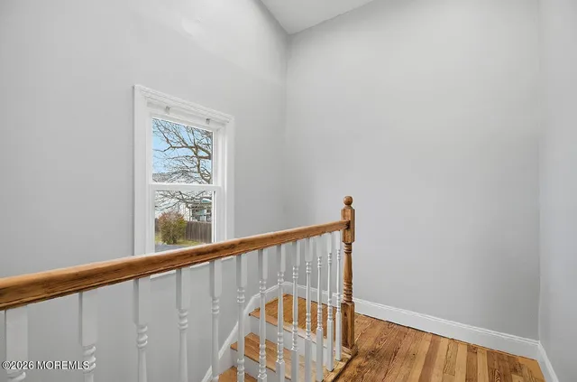 a view of a balcony with wooden floor