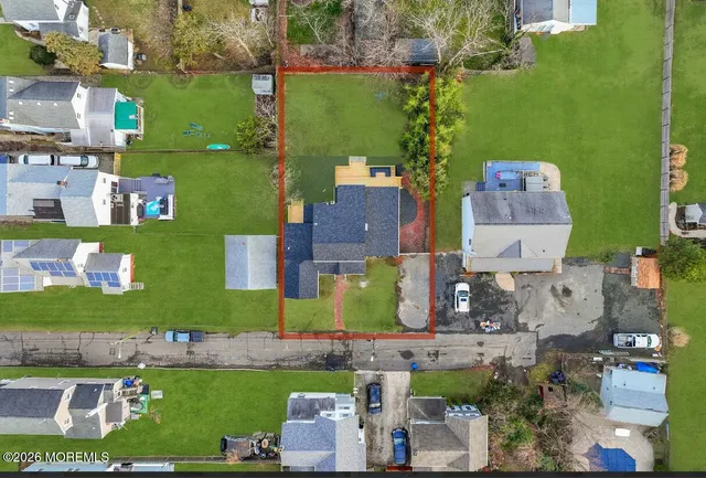 an aerial view of a house with a garden