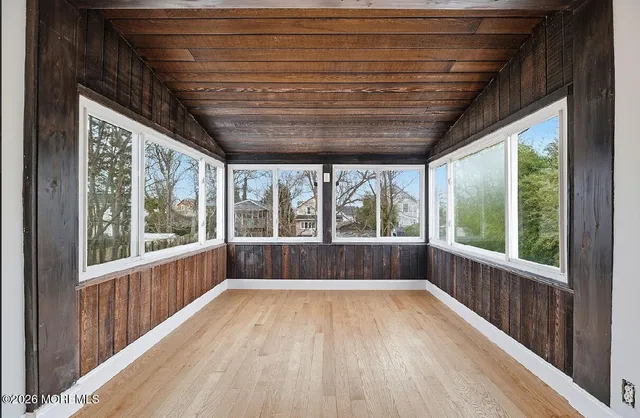 a view of entryway with wooden floor