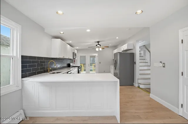a view of kitchen with cabinets and stainless steel appliances