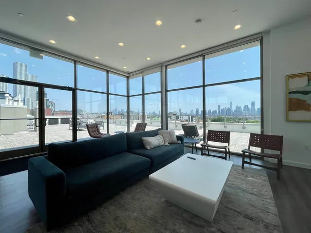 a living room with furniture and a large window