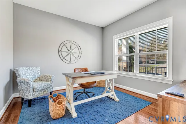 a view of a livingroom with furniture and a window