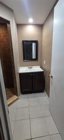 a room with a wooden floor and washing machine
