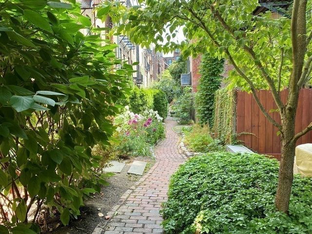 a backyard of a house with lots of green space