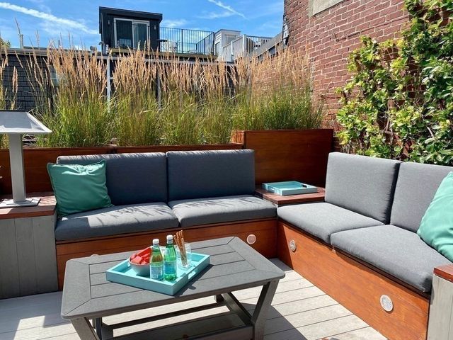 a outdoor living space with furniture and a fireplace