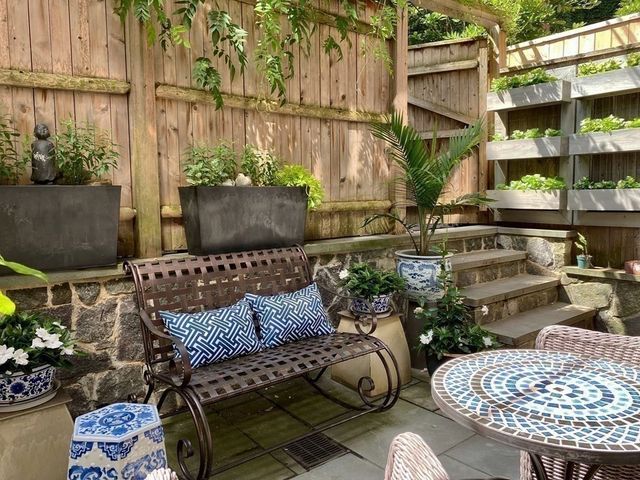 a outdoor living space with furniture and a potted plant
