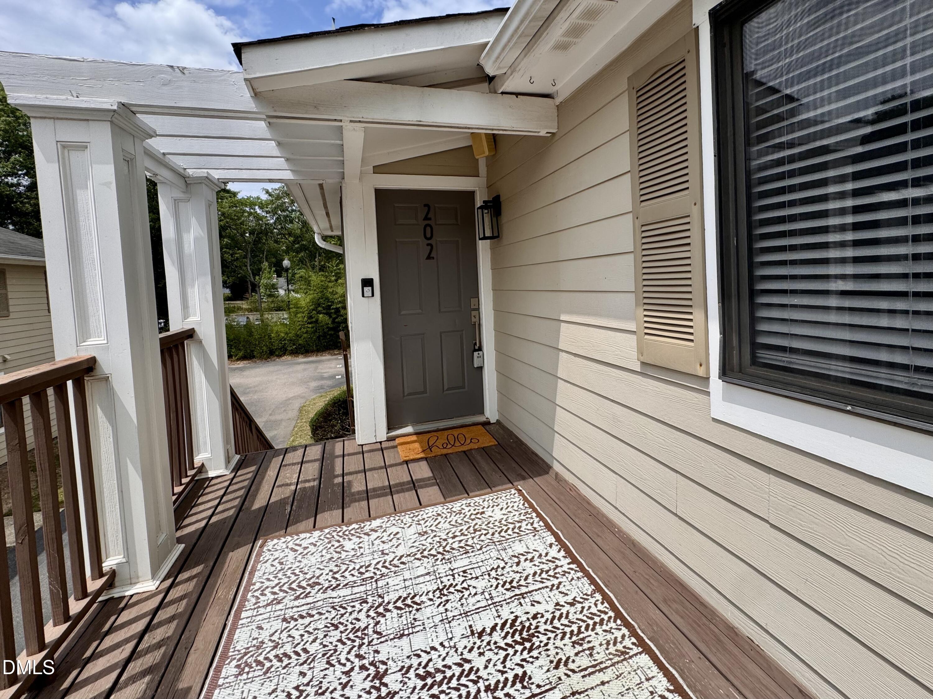 2204 Stafford Avenue, Unit 202 Raleigh, NC 27607 - Photo 2 of 15 a view of a balcony with a door