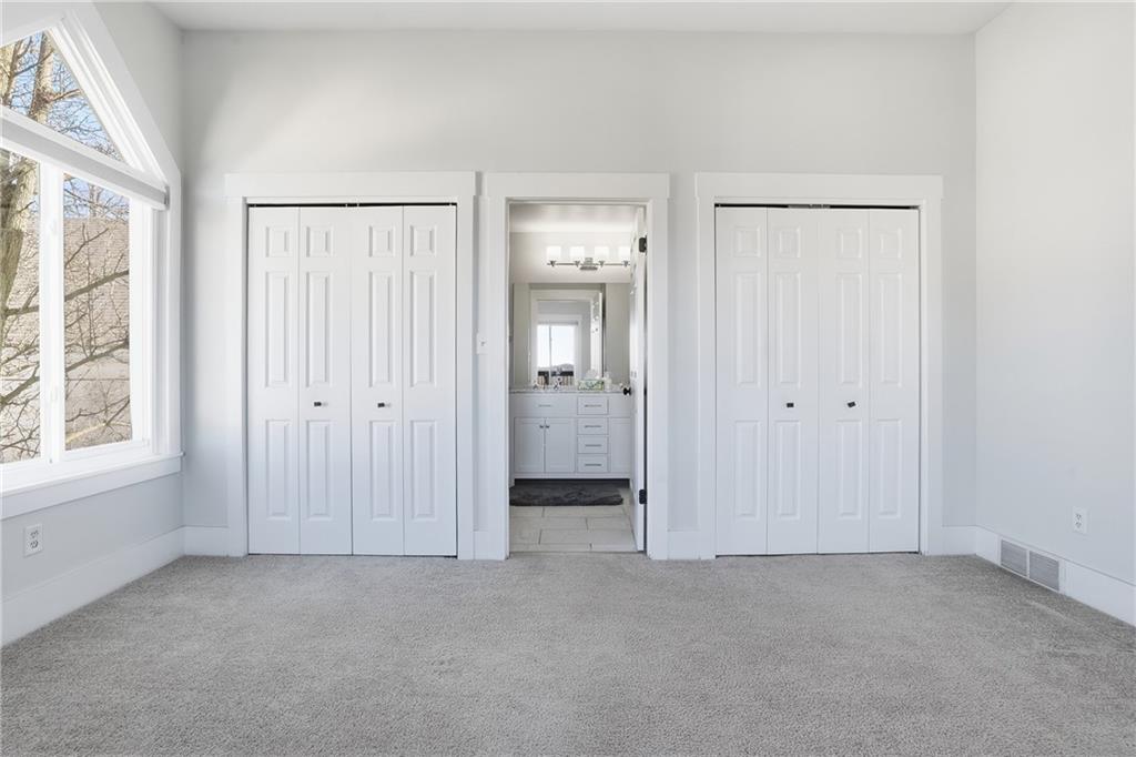 7 Ridgemead Fields Drive Verona, PA 15147 - Photo 27 of 48 The primary bedroom includes an ensuite that is also available to guests through the hallway.
