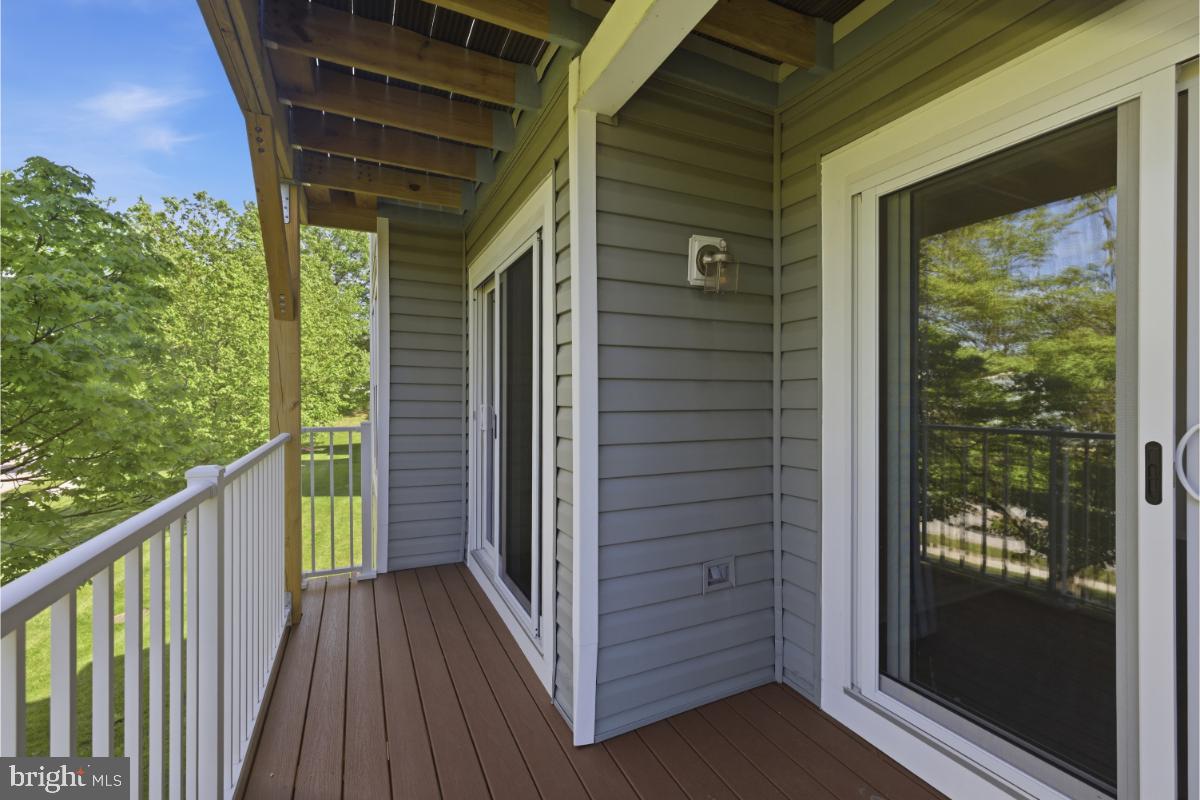 6470 Greenfield Road, Unit 1105 Elkridge, MD 21075 - Photo 14 of 18 Serene balcony with lush views.