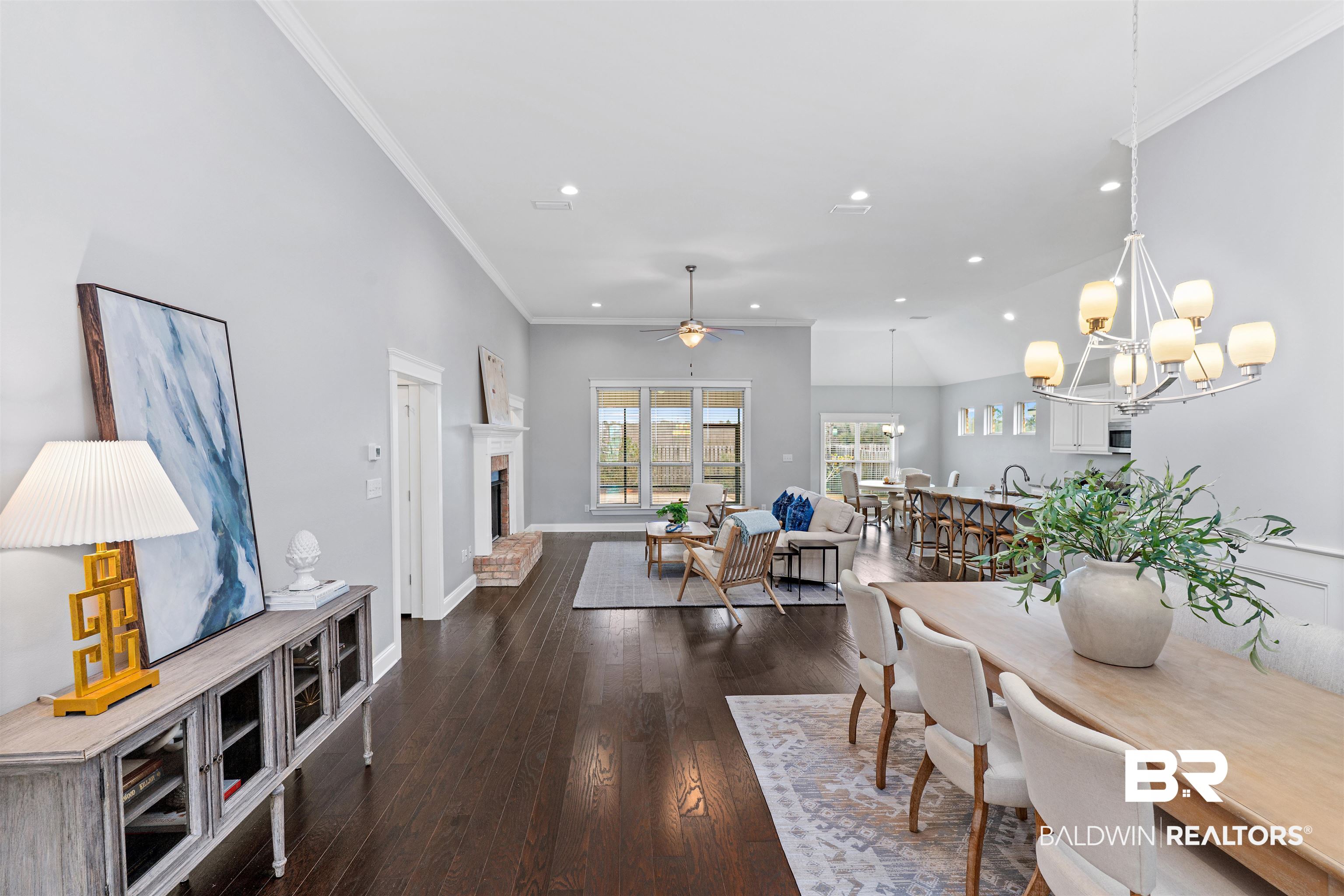 24838 Slater Mill Road Daphne, AL 36526 - Photo 3 of 46 Dining area featuring ceiling fan, recessed lighting, a fireplace, dark wood-style flooring, and ornamental molding