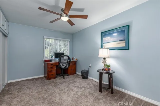 a workspace with furniture and window