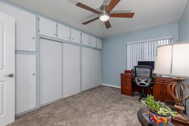 a view of a workspace with furniture