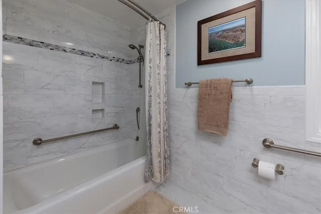 a bathroom with a tub and a shower
